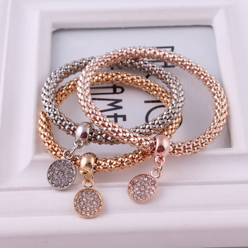 Jeweled Metal Disc Charm Bracelets