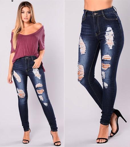 Jeans ajustados de mezclilla oscuro rasgados